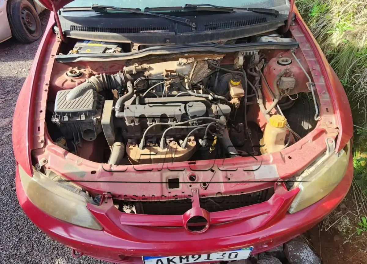 LOTE 004 - Automóvel GM CELTA 5 PORTAS, ano/modelo 2002/2003, cor vermelha