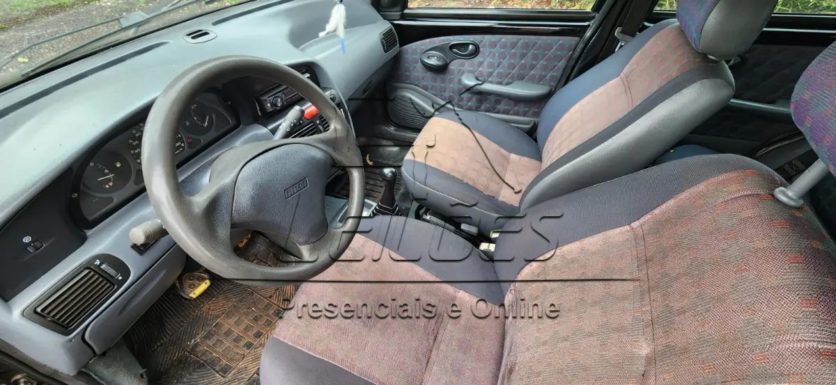 LOTE C-002 - FIAT/PALIO EX, ano/modelo 1999/1999, cor preta, à gasolina, 4 portas, emplacado em Carazinho/RS.